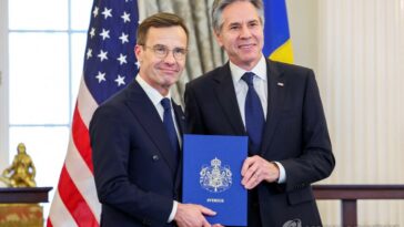 (LEAD) Sweden formally joins NATO as 32nd member