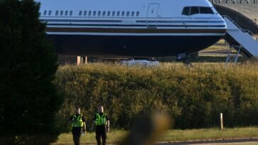 A Boeing 767 on the runway at a military base in Salisbury in the UK in June 2022, as it prepared to fly asylum-seekers to Rwanda. The flight was blocked by European judges. (Photo by JUSTIN TALLIS / AFP)