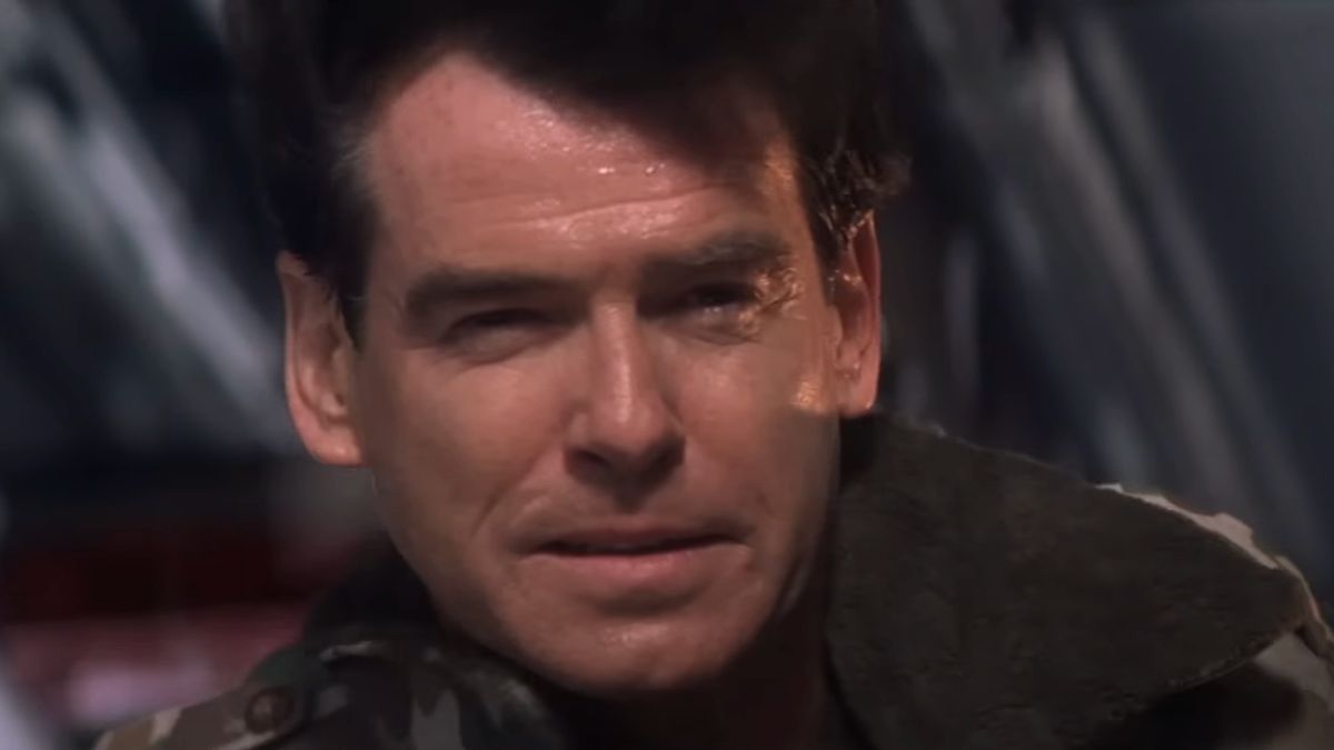 Pierce Brosnan crouches with a pleased look in Die Another Day.