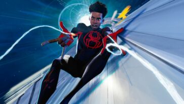 Miles shooting webs on top of a moving train in Spider-Man: Across The Spider-Verse.