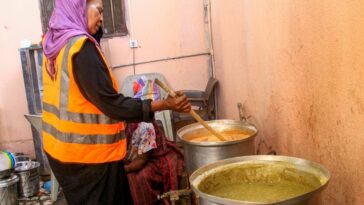 A volunteer cooks food for internally displaced Muslim devotees breaking fast meals during the Islamic holy month of Ramadan in Gedaref. (AFP)