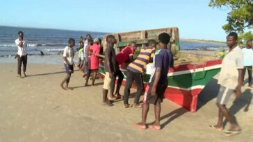 A video grab obtained from TVM on 8 April 2024 shows the boat that sunk off the north coast of Mozambique killing at least 97 people, on the Island of Mozambique. (TVM / AFP)