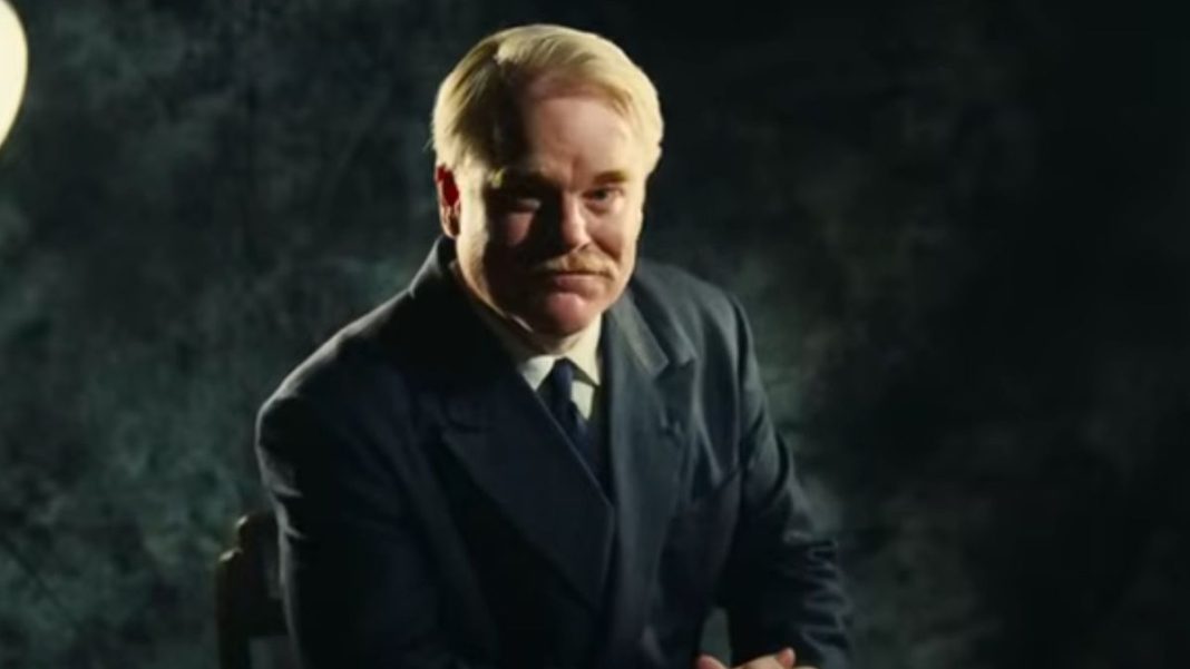 Philip Seymour Hoffman getting his picture taken in The Master