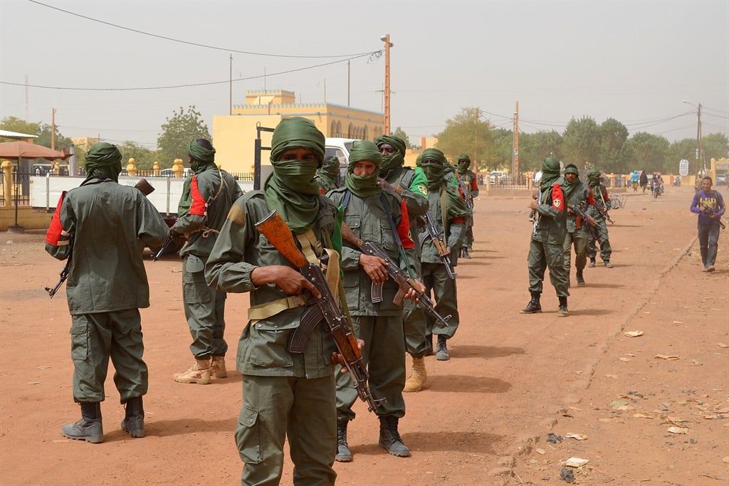 Malian army soldiers, pro-government militia members and former rebels, predominantly Tuaregs, on joint patrol in Gao in northern Mali in February 2017. (AFP)