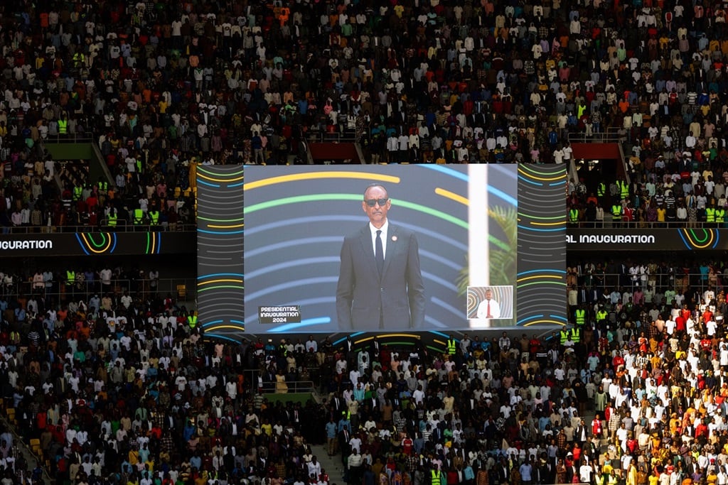 Rwanda President Paul Kagame is seen on screen moments after taking the oath of office in front of supporters during the Presidential Inauguration ceremony at the Amahoro stadium in Kigali on 11 August 2024. (GUILLEM SARTORIO/AFP)