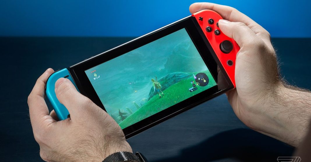 Someone playing The Legend of Zelda: Breath of the Wild on a Nintendo Switch handheld console.