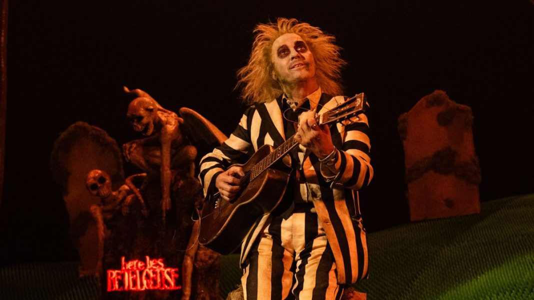 Beetlejuice with a guitar in Beetlejuice Beetlejuice