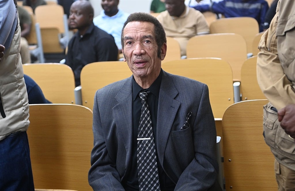 Former Botswana president Ian Khama (C) sits in the Broadhurst Magistrate court in Gaborone on 13 September 2024. (Monirul Bhuiyan/AFP)