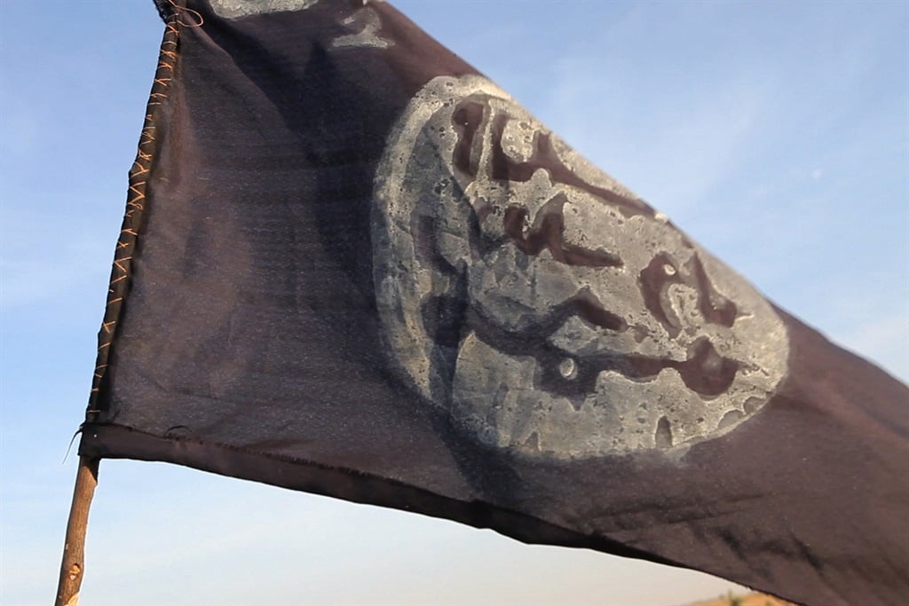 A Boko Haram flag flutters from an abandoned command post. (Stephane Yas/AFP)