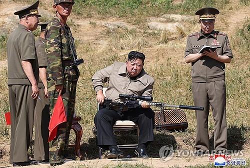 NK leader inspects special operation forces, test-firing of multiple rocket launcher