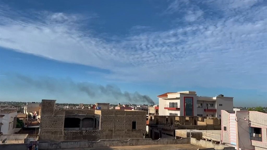 Smoke rising from an area near the Bamako airport after shots and detonations were heard. (AFPTV / AFP)