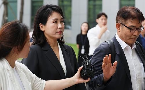 Opposition leader Lee's wife questioned over alleged corporate card misuse