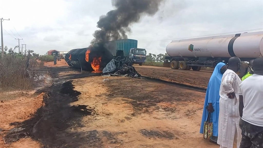 A fuel tanker exploded after colliding with a truck carrying passengers and cattle in northern Nigeria, killing at least 59 people, a rescue agency said on 9 September 2024. (Niger State Emergency Management Agency / AFP) 