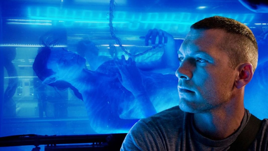 Sam Worthington sits in front of his Na&#039;vi tank in Avatar.