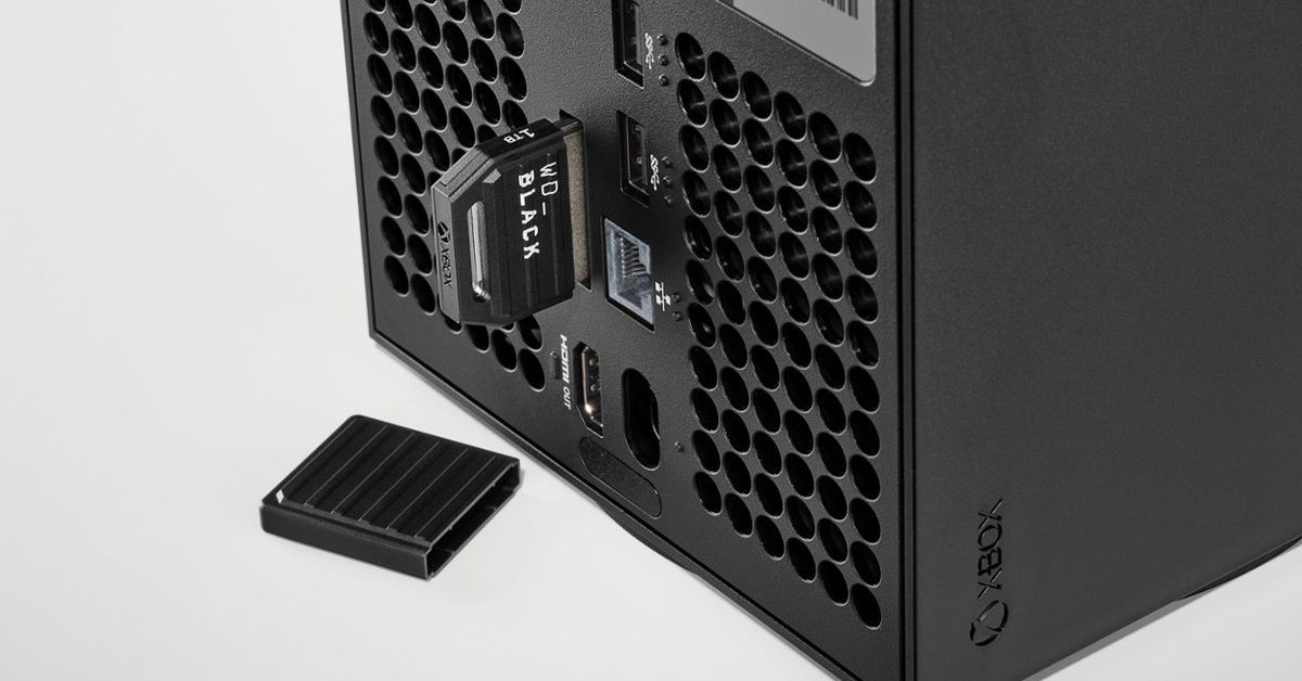 A WD_Black C50 storage expansion card plugged into the back of an Xbox Series X console.