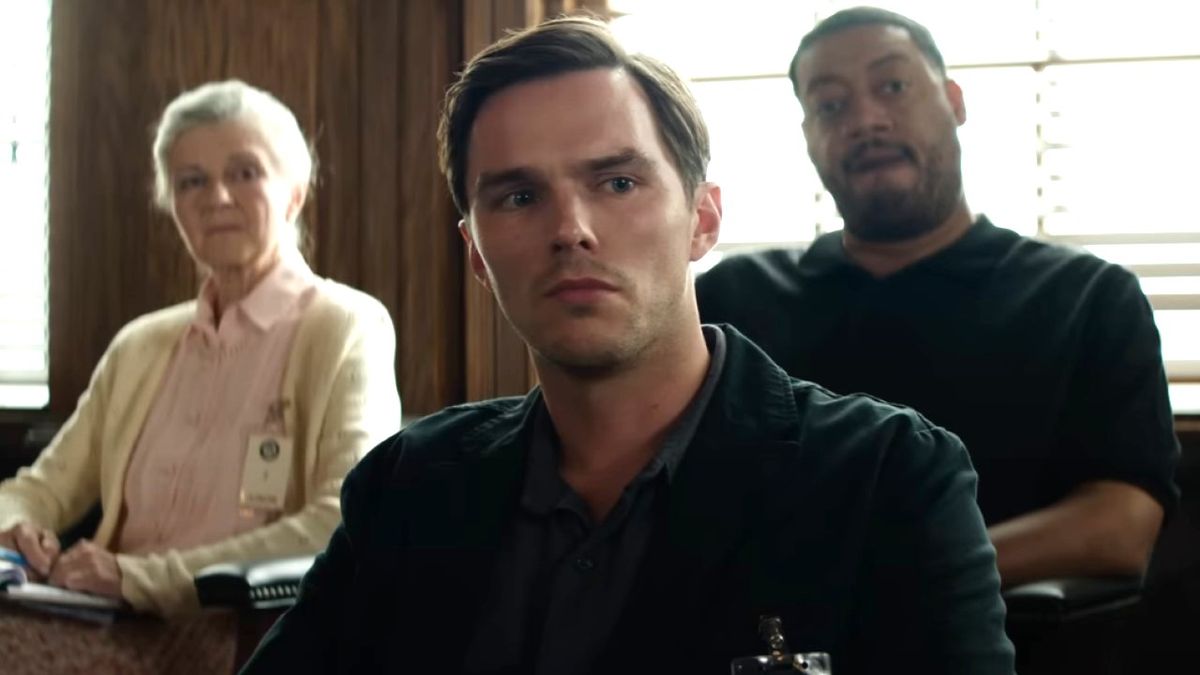 Nicholas Hoult playing Justin Kemp looking serious in court in Juror No. 2.