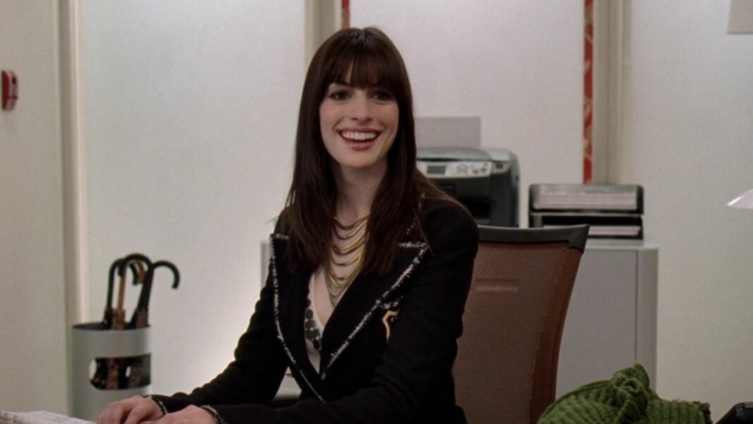 Andy smiling wildly about wearing the Chanel Boots in The Devil Wears Prada.