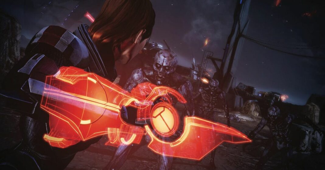 Screenshot from the Mass Effect Legendary Edition featuring Commander Shepard posed to hit a monster with her omni-blade.