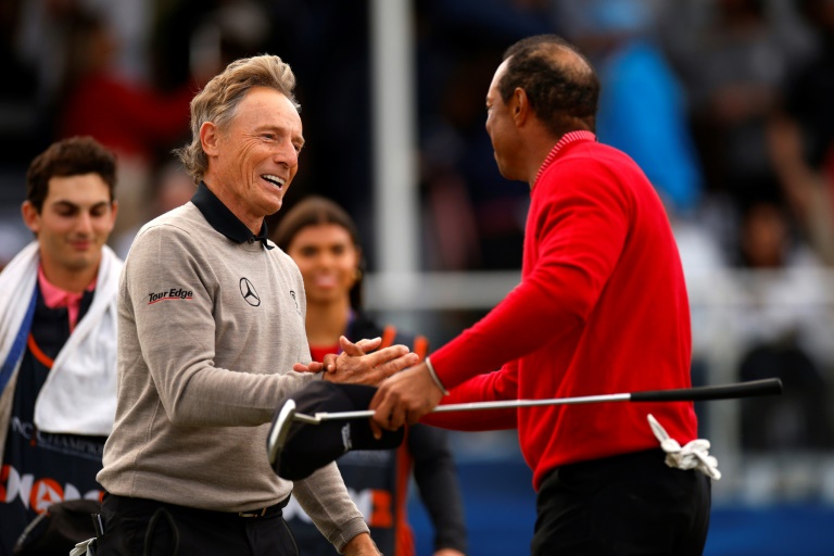 Tiger Woods and Bernhard Langer shake hands after Team Langer