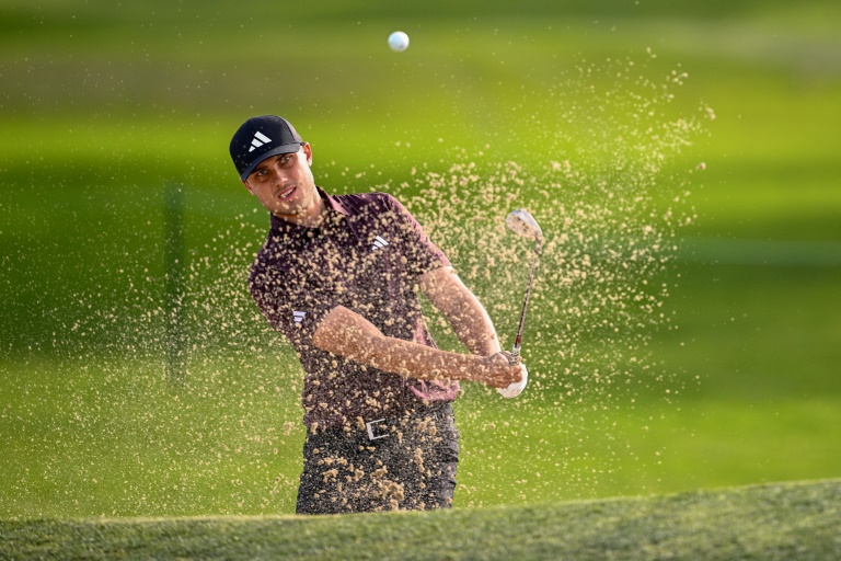 Ludvig Aberg blasts out of a bunker on his way to a nine-under-par 63 at the PGA Tour