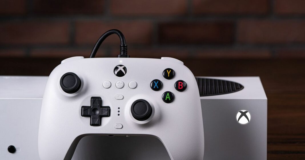 White 8Bitdo Ultimate wired controller in front of Xbox Series S