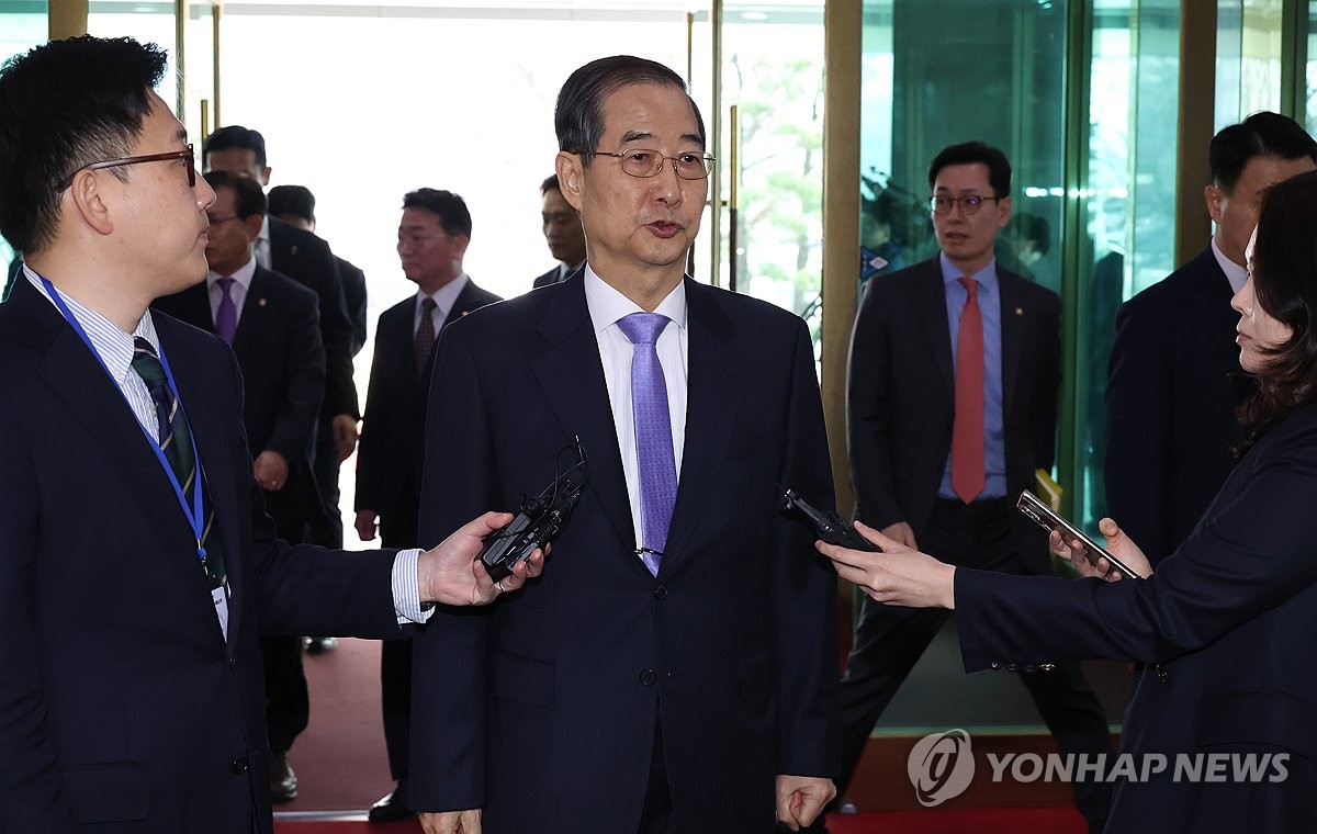 Acting President Han vows to address urgent issues after reinstatement