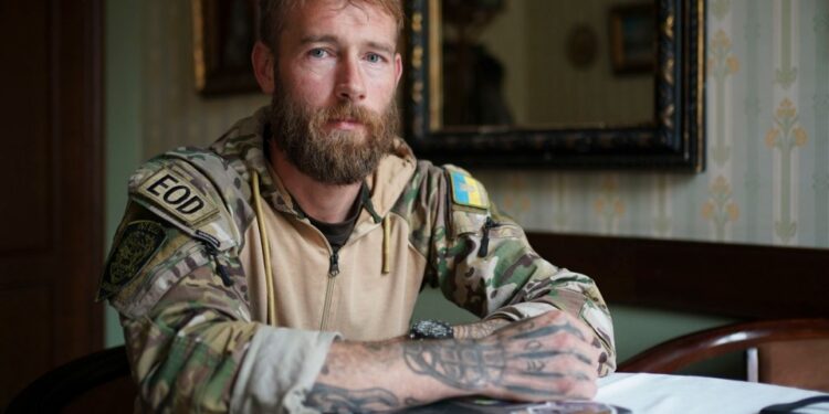 Retrato de un experto en eliminación de bombas británicas.
