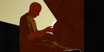 Carta de lectura de prisioneros, brillando con él y a través de la oscuridad alrededor de la celda