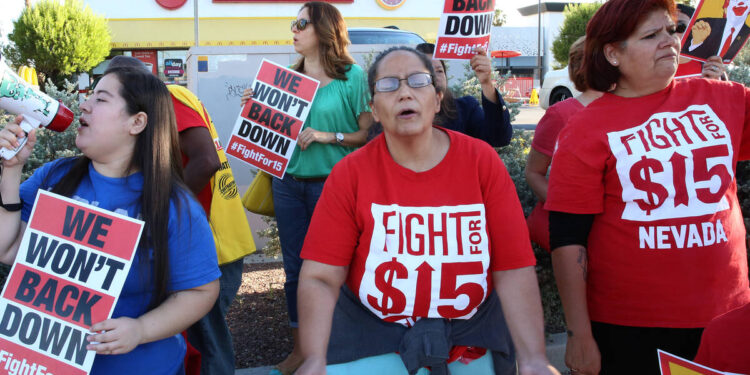 Employees protest for a higher minimum wage outside of a McDonald's in Las Vegas, Nevada, on May 24, 2017.