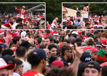 Miles de juerguistas inundan una de las playas más populares de Australia mientras mochileros en bikini celebran el día de Navidad.