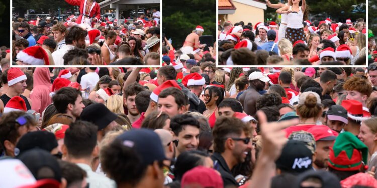 Miles de juerguistas inundan una de las playas más populares de Australia mientras mochileros en bikini celebran el día de Navidad.