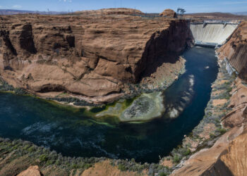 The Colorado River flows below the Glen Canyon Dam on April 18, 2023, in Page, Arizona.