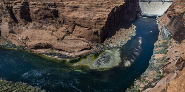 The Colorado River flows below the Glen Canyon Dam on April 18, 2023, in Page, Arizona.